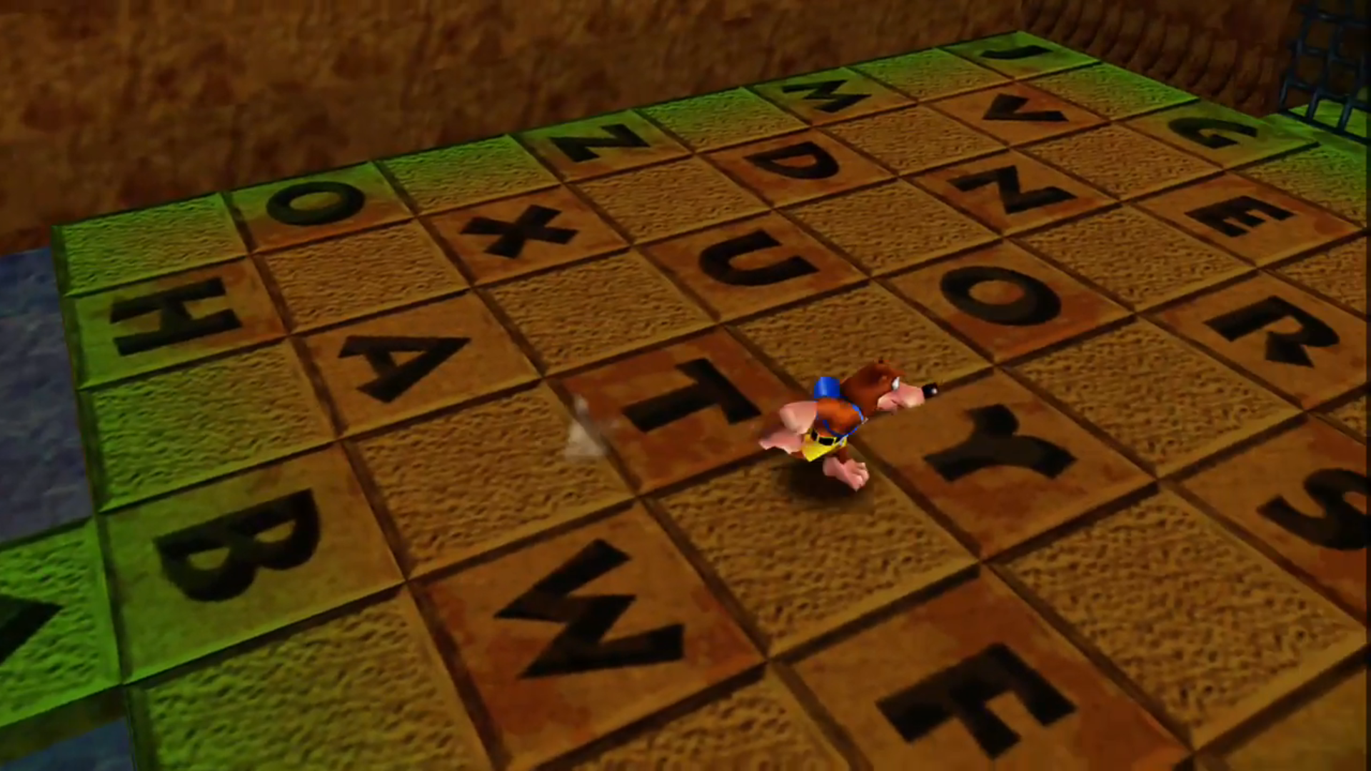 Inside the sandcastle found in Treasure Trove Cove, within Banjo Kazooie. Floor shows tiles with all letters of the alphabet